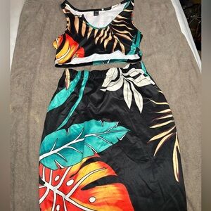 Black crop top two piece skirt set.